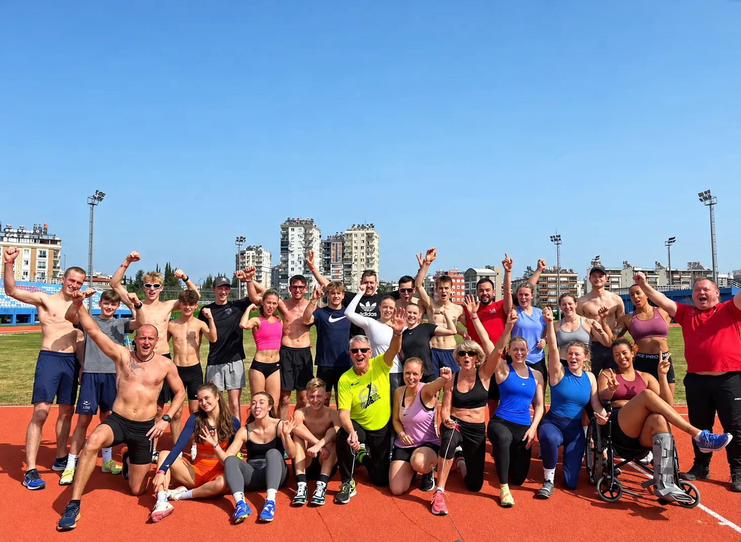 Training group celebrating together on the track